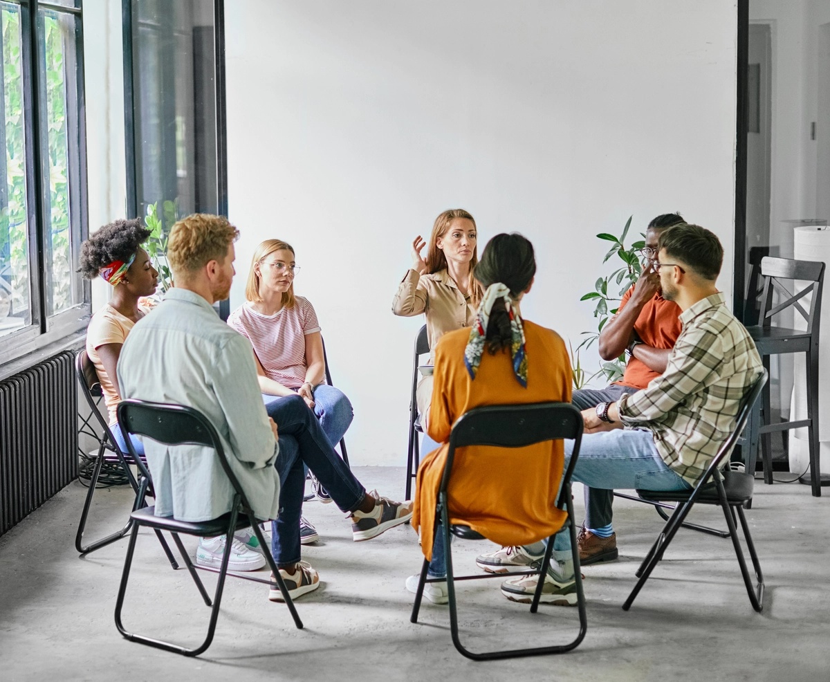 Cocaine Addiction: Group of people sitting in a circle in an AA meeting